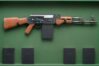Spreading Religion  -  Kalashnikov with 5 religious prayerbooks 2018 60x115cm